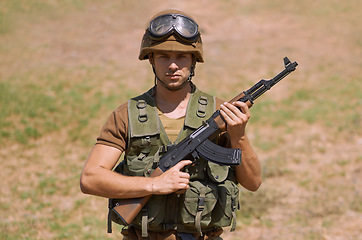 Image showing Military, gun and training with portrait of man in nature for war, conflict and patriotism. Army, surveillance and security with person and rifle gear in outdoors for soldier, battlefield and veteran