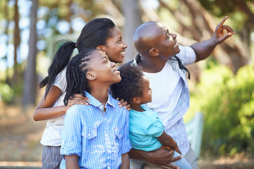 Image showing Smile, hiking and pointing with a black family in the forest together for travel, adventure or discovery. Mother, father and children outdoor in nature, the environment of woods for summer exploring