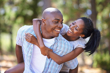 Image showing Piggyback, laughing or happy black couple in forest to relax or bond on holiday vacation together in nature. Wellness, hug or African woman with smile or man in woods hiking on outdoor park adventure