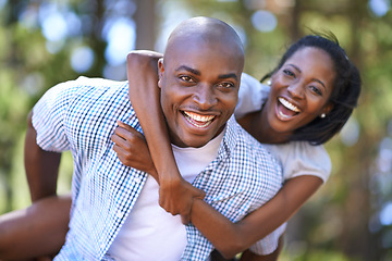 Image showing Piggyback, portrait or happy black couple in forest to relax or bond on holiday vacation together in nature. Hiking, travel or African woman with smile, love or man in woods on outdoor park adventure