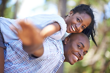 Image showing Piggyback, portrait or happy black couple in park to relax or bond on holiday vacation together to travel. Romantic, playing or African woman with smile, care or man in woods on fun outdoor adventure