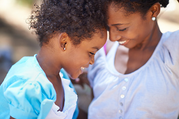 Image showing Daughter, love or mother in nature or forest to relax, care or bond on a summer holiday vacation. Kid, forehead or happy African mom in park or woods on outdoor adventure with support or black family