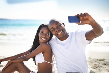 Image showing Smile, selfie and black couple at beach on holiday, summer vacation and travel in nature. African man, woman and picture at ocean, sea and happy together, relax or love outdoor on valentines day date