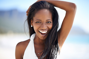 Image showing Portrait of black woman on beach, holiday and smile with blue sky, sunshine and tropical island travel. Sea, mountain and relax, girl on ocean vacation for summer adventure with peace and happiness.