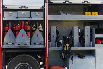 Image showing Close-up of essential firefighting equipment on a modern firetruck, showcasing tools and gear ready for emergency response to hazardous fire situations