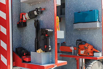 Image showing Close-up of essential firefighting equipment on a modern firetruck, showcasing tools and gear ready for emergency response to hazardous fire situations