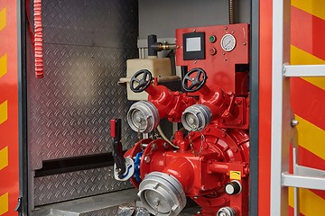 Image showing Close-up of essential firefighting equipment on a modern firetruck, showcasing tools and gear ready for emergency response to hazardous fire situations