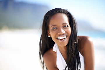 Image showing Portrait of black woman on beach, vacation and smile with freedom, sunshine and tropical island travel. Sea, mountain and girl on ocean holiday in summer with adventure, peace and blurred background.