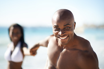 Image showing Portrait of black couple on beach, holding hands and smile on holiday with sunshine, tropical island and travel. Sea, happy man and woman on ocean vacation in summer with adventure, love and blue sky