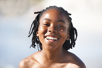 Image showing Face, black boy and happiness on beach with family for adventure, holiday or vacation in summer. African kid, face and smile outdoor in nature for break, experience or bonding with shirtless with fun