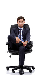 Image showing Businessman, portrait and manager sitting in a chair with white background or mock up space in studio. Serious, entrepreneur and waiting on seat with professional style, fashion or suit for work