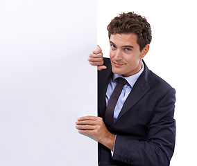 Image showing Banner, portrait and business man with mockup in studio for news, guide or advertising space on white background. Poster, face and male entrepreneur with recruitment presentation, checklist or offer