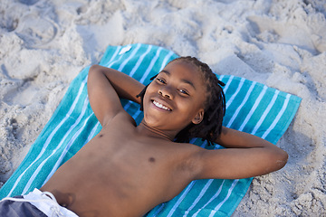 Image showing Portrait, beach sand and towel with child to relax and summer holiday with sunshine in nature. Black teenager, face and smile for leisure on vacation, cape town and seaside for wellness in outdoor