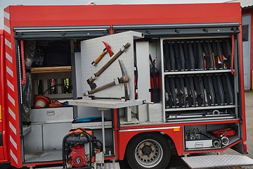 Image showing Close-up of essential firefighting equipment on a modern firetruck, showcasing tools and gear ready for emergency response to hazardous fire situations