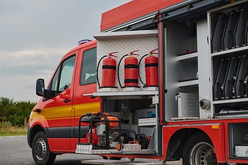 Image showing Close-up of essential firefighting equipment on a modern firetruck, showcasing tools and gear ready for emergency response to hazardous fire situations