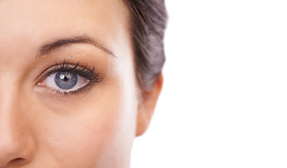 Image showing Woman, face and eye on mockup space for sight, cosmetics or skincare against a white studio background. Closeup portrait of young female person, eyelash or model half staring with optical vision