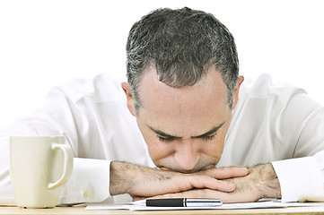 Image showing Businessman resting head on hands