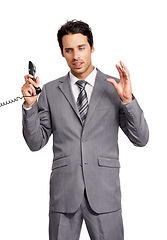 Image showing Telephone call, frustrated business man and stress, wrong or argument isolated on a white studio background. Landline, problem and professional listen, communication and fail in negotiation mistake