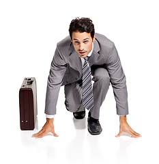 Image showing Ready, run and portrait of businessman with briefcase in studio kneeling, confident or prepared on white background. Corporate, rat race and face of male entrepreneur with time management efficiency