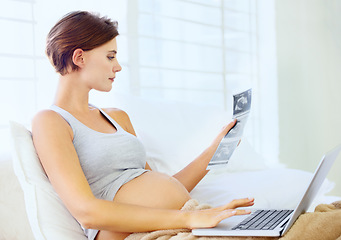 Image showing Pregnant woman, laptop and ultrasound image in home with relax wellness and excited on prenatal care in bedroom. Person, love or sonogram photo with technology on bed, fetus growth or development