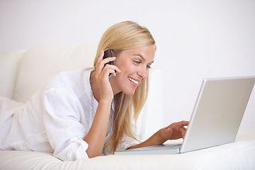 Image showing Woman, phone call and remote work with laptop on sofa for social network, digital subscription and communication at home. Happy freelancer, computer and talking on smartphone for online connection