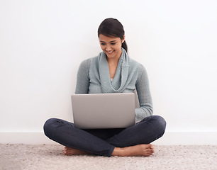 Image showing Happy woman, laptop and relax on floor for communication, email or online research at home. Young female person or freelancer smile in remote work on computer for search, networking or streaming