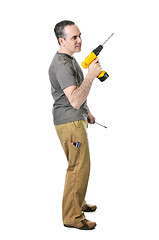 Image showing Handyman with a drill and screwdriver