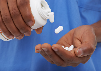 Image showing Hands, pills and bottle for healthcare with doctor or nurse, prescription medicine or supplements. Medication, medical and wellness with vitamins, treatment and person with pharmaceutical drugs