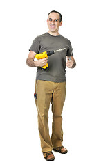 Image showing Handyman with a drill and screwdriver