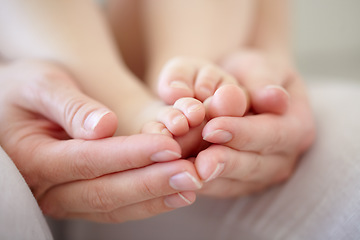Image showing Love, mother and hands with baby or feet for development, nurture and bonding in nursery of apartment. Family, woman or newborn toes with relax, support or care for relationship or motherhood in home