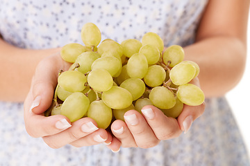 Image showing Health, hands and closeup of woman with grapes in a studio for detox, vegan diet and fresh ingredient. Wellness, nutrition and zoom of female model with organic fruit for vitamins by white background