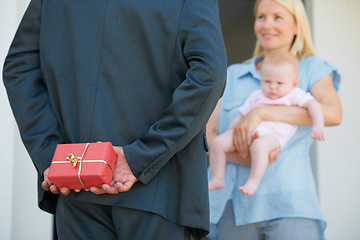 Image showing Husband, wife and hiding gift box for surprise, look and happiness with baby, love and appreciation. Present, romance and good news for marriage, relationship and announcement with romantic partner