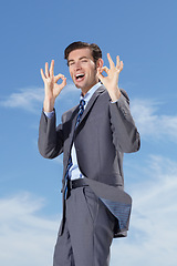 Image showing Portrait, businessman and smile with okay sign with sky for decision, choice or option for career. Happy person, male consultant and gesture for yes, agree or success for suggestion of corporate job