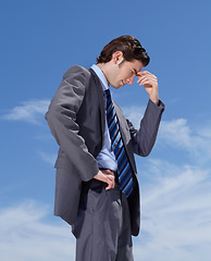 Image showing Businessman, face and headache for stress with job, career or occupation in corporate. Male person, manager or consultant with burnout, mistake or migraine with mental health for overtime with sky