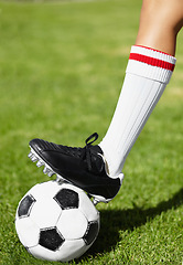 Image showing Soccer, shoes and ball on field, sport and outdoor for competition, training and cleats in closeup. Football, person and steps with legs, foot and socks for exercise, grass and pitch for contest