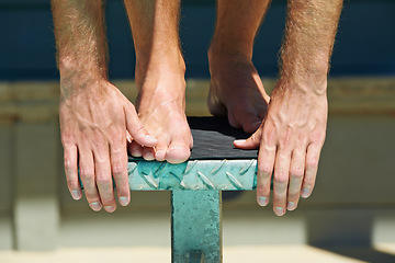 Image showing Swimming, legs and sports person on podium for fitness exercise, outdoor practice or practice race. Hands, athlete commitment and swimmer start competition, cardio performance or training for contest