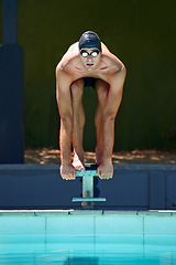 Image showing Swimming, sports and man on start block, platform or podium for outdoor fitness exercise, practice or race. Training, athlete and swimmer ready for competition, cardio performance or contest