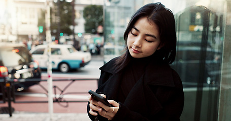 Image showing Phone, city and Japanese woman on social media, reading email or notification in Tokyo. Smartphone, girl and person on mobile in urban street outdoor for communication technology, network or internet