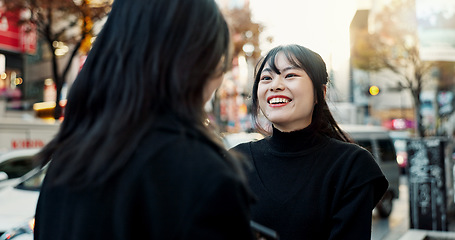 Image showing Happy, women and friends in a street, conversation and chatting with fun, vacation and reunion. People, Japan and girls with joy, discussion and cheerful in the road, urban town and communication