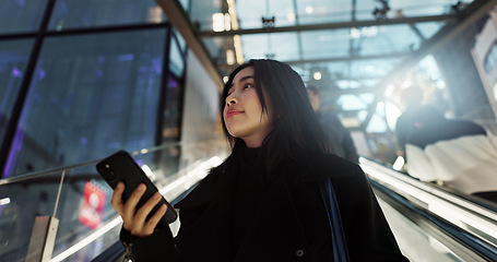 Image showing Japanese, woman on escalator and phone, travel and commute, communication with social media and adventure. Text, email and online chat with connectivity, subway or airport with mobile app in Japan