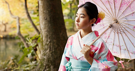 Image showing Thinking, traditional and Japanese woman in park for wellness, fresh air and relax with umbrella outdoors. Travel, culture and person in indigenous clothes, style and kimono for peace in nature