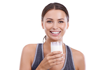 Image showing Woman, portrait and glass of milk in studio for wellness, calcium and bone health with happiness or mockup space. Athlete, person or face with smile for nutrition or dairy product on white background