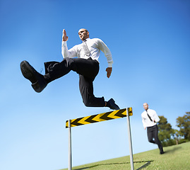 Image showing Businessman, hurdle and jumping for career competition or employee obstacle, opponent or achievement. Male people, corporate rivals and leap for professional growth or challenge, milestone or mockup