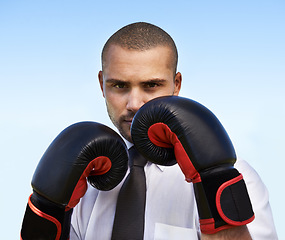 Image showing Business man, portrait and boxing gloves for attack or warrior, self defence and fitness for power. Male person, strong and equipment for fight or corporate challenge, exercise and sky background