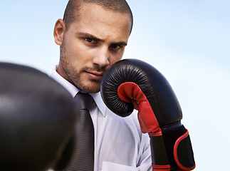Image showing Business man, portrait and boxing gloves for attack or warrior, self defence and fitness for power. Male person, strong and equipment for fight or corporate challenge, exercise and sky background