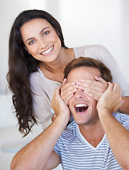 Image showing Surprise, eyes and couple in house with love, affection and playful in marriage with care bonding. Woman, hands and man face for relationship fun on anniversary, together and happiness in living room