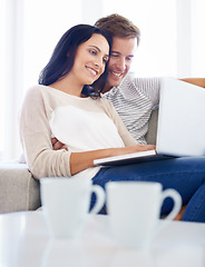 Image showing Couple, laptop and watch movies on sofa with love, living room and wellness in marriage for bonding. Woman, man and smile for relationship care on subscription, weekend and streaming video in home