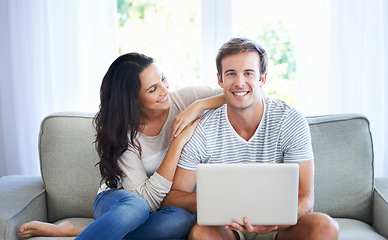 Image showing Couple, love and relax on sofa with laptop, living room and marriage for care bonding on weekend. Woman, man and romantic for relationship with streaming internet, commitment and happy in apartment