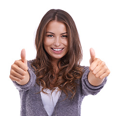 Image showing Happy woman, portrait and thumbs up for good job, winning or success on a white studio background. Face of female person smile with like emoji, yes sign or OK for approval, thank you or achievement