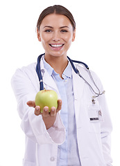 Image showing Doctor, woman and portrait with apple in studio for vitamin c benefits, healthcare and detox on white background. Happy dietician, nutritionist and medical worker with fruits, healthy food and fiber